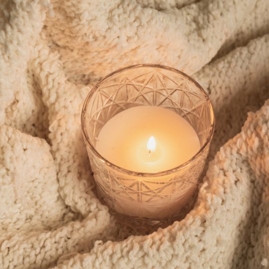 candle and blanket